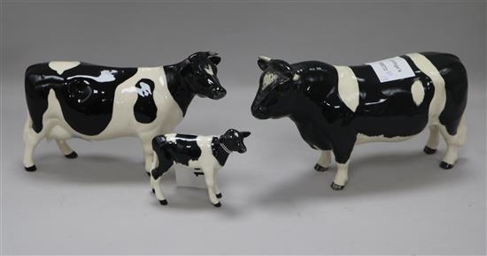 A Beswick Friesian cattle family comprising bull 1439A, cow 1362A and calf 1249C, gloss